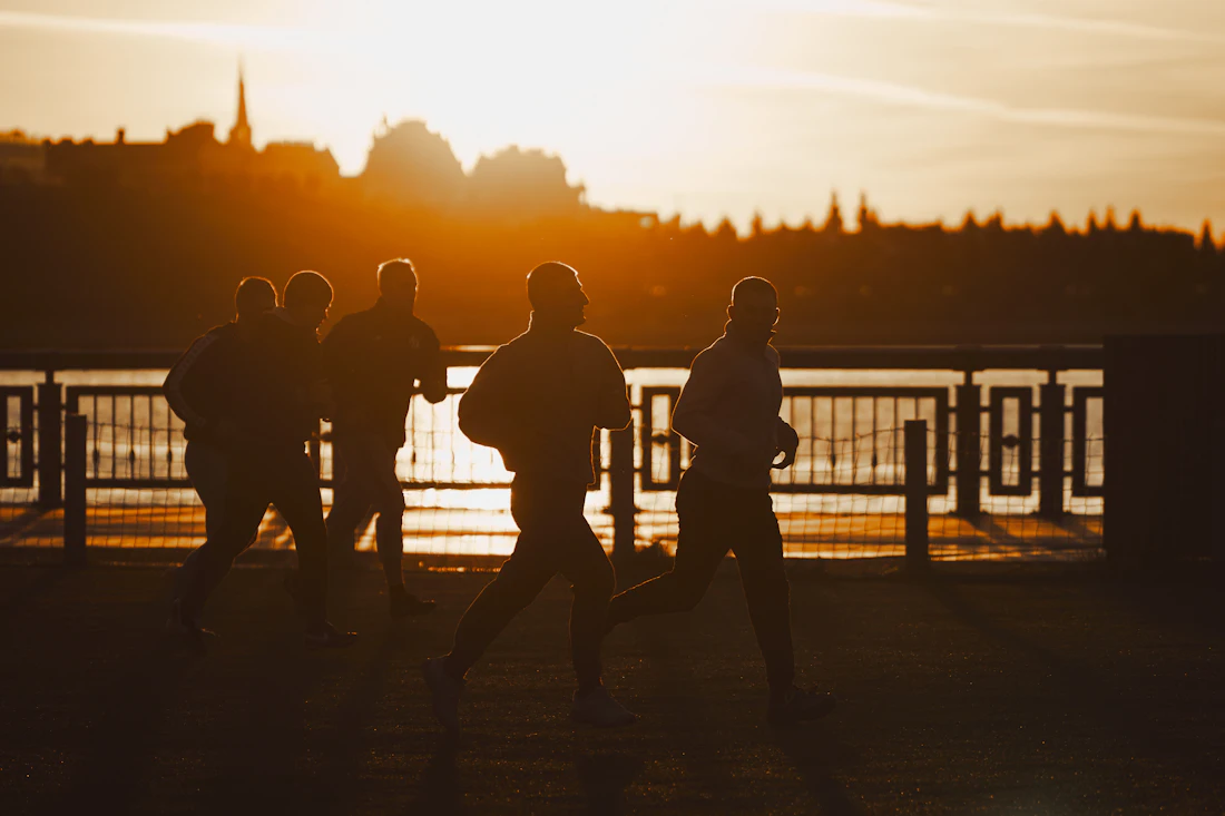 Group of friends running together